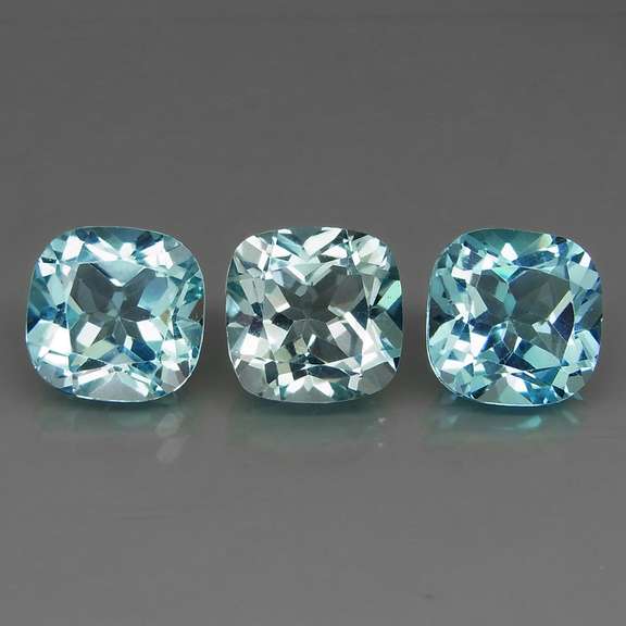 Large 16.62ct vivid blue cushion cut Topaz set