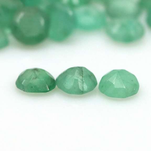 Rich emerald green 6.46ct 37pc emerald set