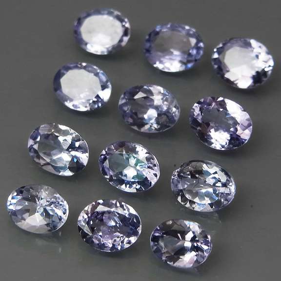 Heavy flashing 3.99ct oval cut Tanzanite set
