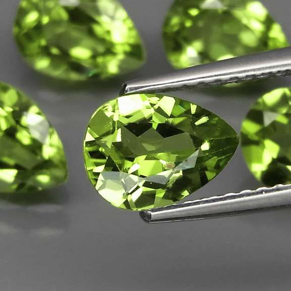 Dazzling 6.17ct untreated apple green Peridot set