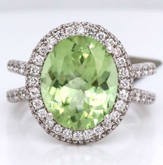 Dreamy 18kt Peridot Oval Cut and RBC Diamond Halo Double Shank Ring