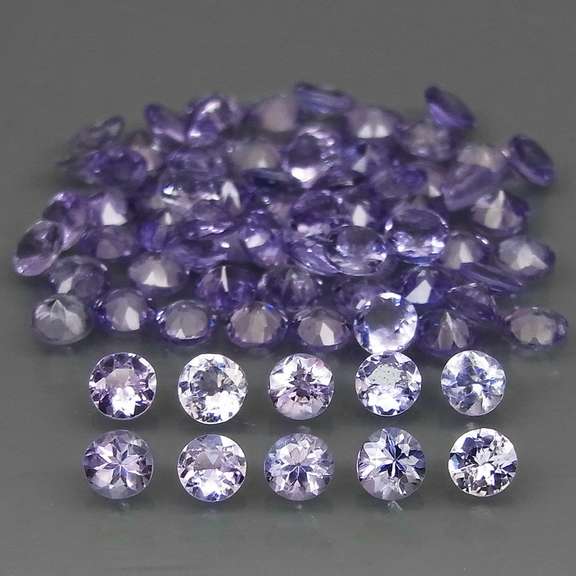 Heavy flashing 5.06ct diamond cut Tanzanite set