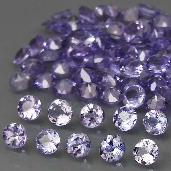 Heavy flashing 5.06ct diamond cut Tanzanite set