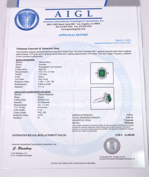 Radiant Lady's Platinum Ring with Emerald and Diamonds