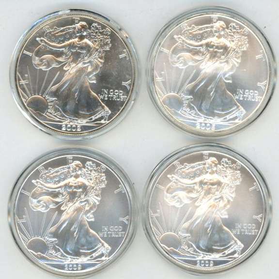 4 Assorted Superb Gem BU $1 American Silver Eagle. Capsules