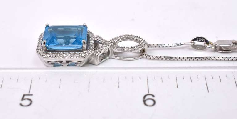 Magnificent Emerald Cut Blue Topaz in 14k White Gold with Diamonds