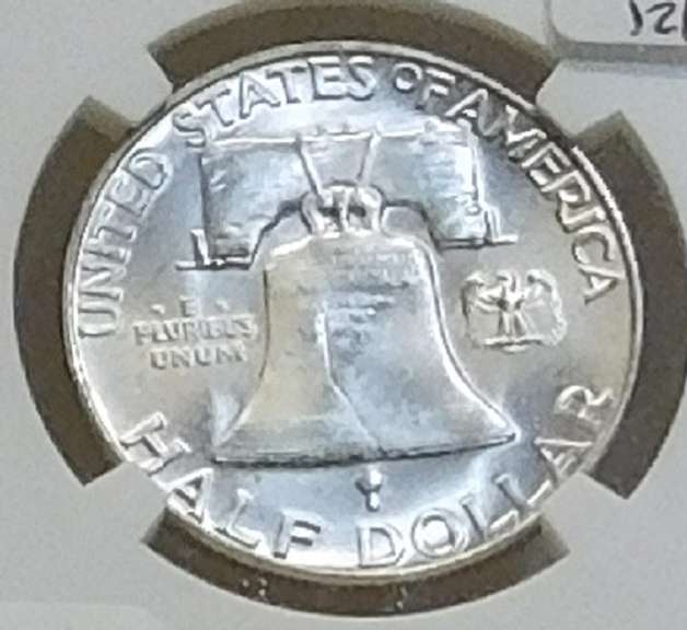 1956 Sil Franklin Hf NGC MS-64-FBL near GEM.   NOTE:  The horozontal lines on the Liberty Bell, on the reverse,  are the high-points of the coin.  Consequently, only a very small percentage of examples show continuous and uninterrupted grooves (Full Bell Lines; FBL) on every line.  Hence, the designation acknowledges the rarity and expanded value.