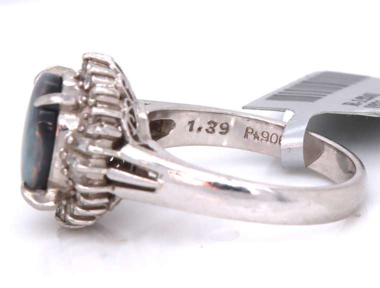 Handsome Oval Black Opal and Baguette Diamond Halo Ring