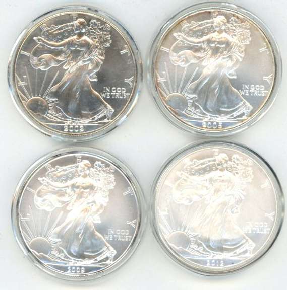 4 diff. Superb Gem BU $1 American Silver Eagles in Capsules