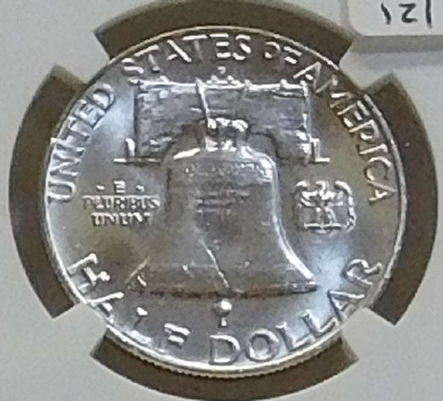 1958-D Sil Franklin Hf NGC MS-64-FBL near GEM.   NOTE:  The horozontal lines on the Liberty Bell, on the reverse,  are the high-points of the coin.  Consequently, only a very small percentage of examples show continuous and uninterrupted grooves (Full Bell Lines; FBL) on every line.  Hence, the designation acknowledges the rarity and expanded value.