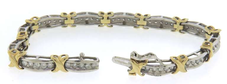 14k white and yellow gold ladies diamond bracelet xo design