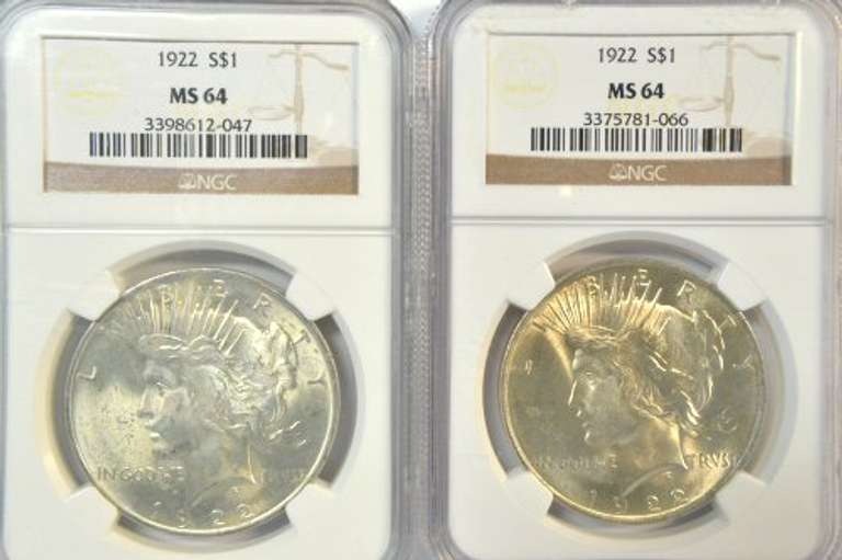 2 near Gem BU 1922 Peace Silver Dollars. NGC MS64