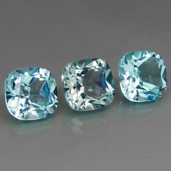 Large 16.62ct vivid blue cushion cut Topaz set