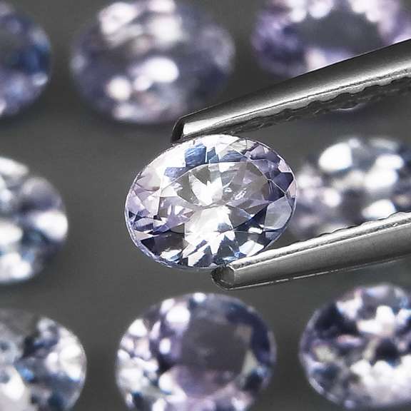 Heavy flashing 3.99ct oval cut Tanzanite set