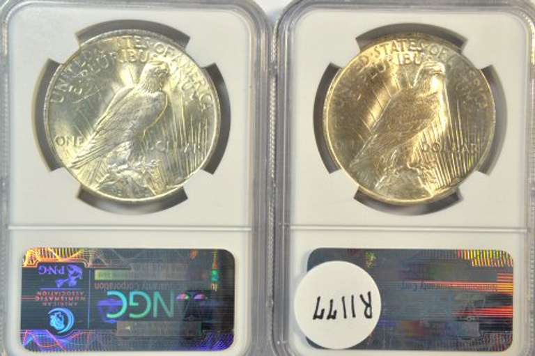 2 near Gem BU 1922 Peace Silver Dollars. NGC MS64