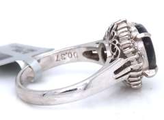 Handsome Oval Black Opal and Baguette Diamond Halo Ring