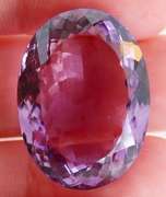 Substantial oval cut 51.91ct violet Amethyst