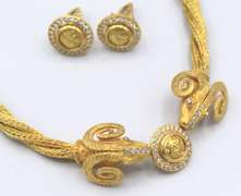 Luxurious 18kt Gold and Diamond Rams Head Necklace and Earring Set