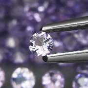 Heavy flashing 5.06ct diamond cut Tanzanite set