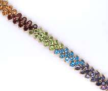 Ladies 14k gold bracelet with multi color gem stones