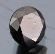 Elegant 1.37ct smooth cut Black Diamond solitaire