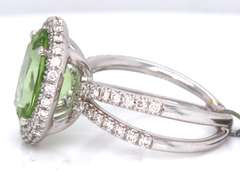 Dreamy 18kt Peridot Oval Cut and RBC Diamond Halo Double Shank Ring