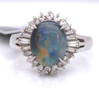 Handsome Oval Black Opal and Baguette Diamond Halo Ring