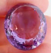 Substantial oval cut 48.27ct violet Amethyst