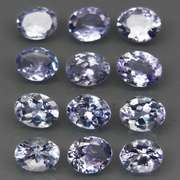 Heavy flashing 3.99ct oval cut Tanzanite set
