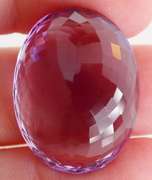 Substantial oval cut 48.27ct violet Amethyst