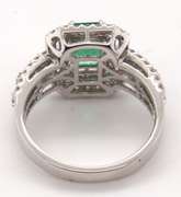 Beautifully Intricate Emeral Ring Engulfed in Diamonds with an 18k Stamped White Gold Band