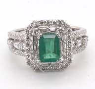 Beautifully Intricate Emeral Ring Engulfed in Diamonds with an 18k Stamped White Gold Band