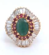 18k yellow gold ladies emerald rubies and diamond ballerina ring.