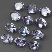 Heavy flashing 3.99ct oval cut Tanzanite set