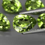 Dazzling 6.17ct untreated apple green Peridot set