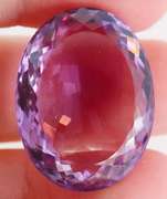 Substantial oval cut 48.27ct violet Amethyst