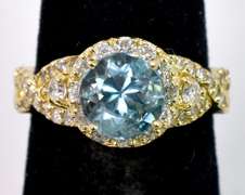 Ravishing 14K Yellow Gold Lady's Ring with Aquamarine and Diamonds.