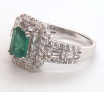 Beautifully Intricate Emeral Ring Engulfed in Diamonds with an 18k Stamped White Gold Band