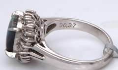 Handsome Oval Black Opal and Baguette Diamond Halo Ring