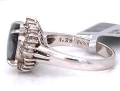 Handsome Oval Black Opal and Baguette Diamond Halo Ring