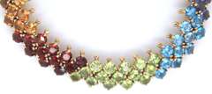 Ladies 14k gold bracelet with multi color gem stones