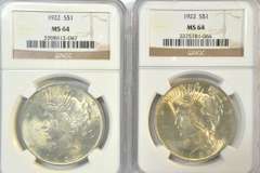 2 near Gem BU 1922 Peace Silver Dollars. NGC MS64