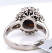 Handsome Oval Black Opal and Baguette Diamond Halo Ring