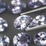 Heavy flashing 3.99ct oval cut Tanzanite set