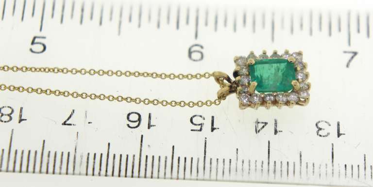 Wonderful Yellow Gold Emerald and Diamond Halo Necklace
