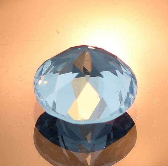 Glittering 4.47ct 10mm sky blue Topaz solitaire