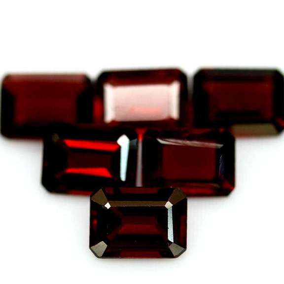 Heavy 10.41ct untreated emerald cut Garnet set