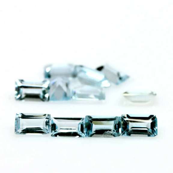 Vivid! 4.16ct emerald cut Swiss blue Topaz set