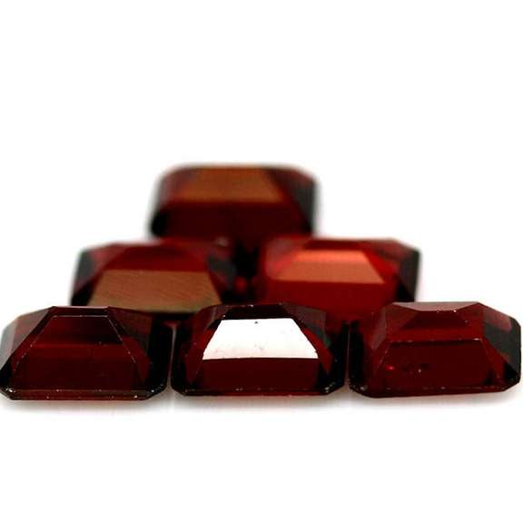 Heavy 10.41ct untreated emerald cut Garnet set