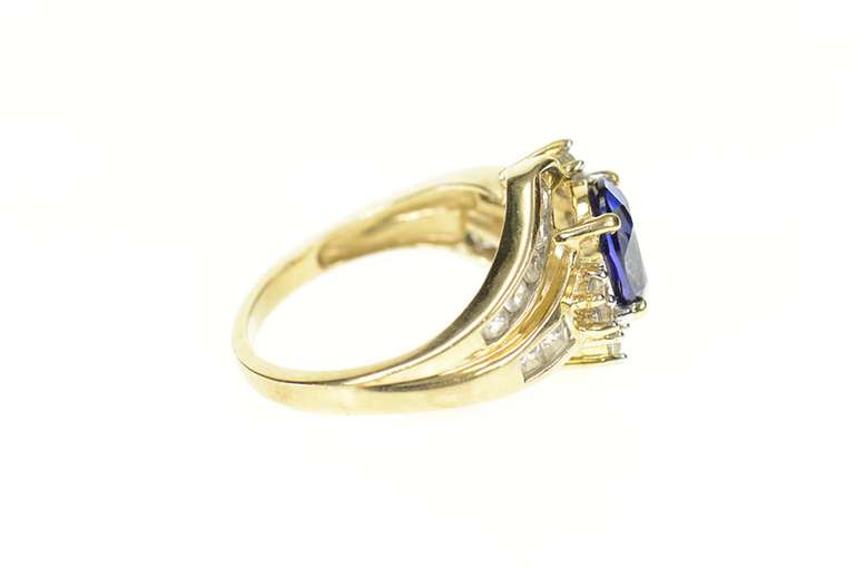 10K Yellow Gold Oval Syn. Sapphire CZ Bypass Statement Ring